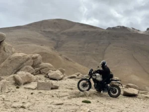 Solo rider among rocks in the Ladakh high desert