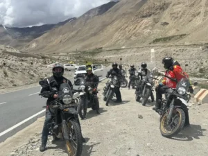 Riders parked on a mountain highway on a Ladakh motorcycle tour
